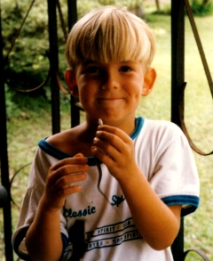 Drew age 5 with small snake in hand